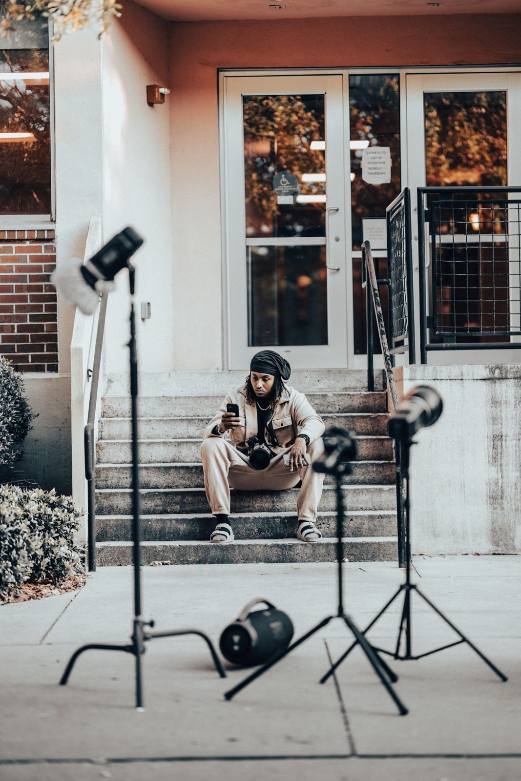 Stretch on set surrounded by his lighting setup